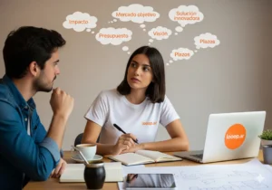 Emprendedora argentina con mate, discutiendo los objetivos (impacto, visión, presupuesto) para un brief de diseño con su equipo en su oficina de Looop.ar.